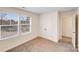 Comfortable bedroom featuring neutral carpet and ample natural light from large windows at 834 N Flint St, Lincolnton, NC 28092