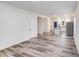 Bright, open-concept living space with durable wood flooring, leading to a modern kitchen at 834 N Flint St, Lincolnton, NC 28092