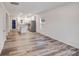 Open-concept living area showcasing durable wood flooring and recessed lighting at 834 N Flint St, Lincolnton, NC 28092