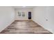 Spacious living room featuring hardwood style flooring, white walls, and natural light from large windows at 834 N Flint St, Lincolnton, NC 28092