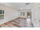 Bright living room with hardwood style flooring, white walls, and open entryway at 834 N Flint St, Lincolnton, NC 28092