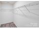 Walk-in closet features carpet floors and wire shelving at 834 N Flint St, Lincolnton, NC 28092