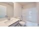 Bathroom featuring a vanity with granite countertop, tub-shower, and sink at 8421 Norman Forest Rd, Lancaster, SC 29720