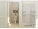 Bright bathroom featuring a white toilet, modern shower with sliding glass doors, and neutral wall art at 8421 Norman Forest Rd, Lancaster, SC 29720