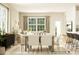 Bright, open-concept dining room with a large table, chairs, and natural light from a large window at 8421 Norman Forest Rd, Lancaster, SC 29720