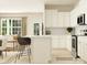 Bright kitchen featuring white cabinetry, island with seating, stainless steel appliances, and open layout at 8421 Norman Forest Rd, Lancaster, SC 29720