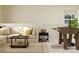 Cozy living room with a sectional sofa, modern coffee table and a foosball table for entertainment at 8421 Norman Forest Rd, Lancaster, SC 29720