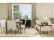 Cozy living space with dining table, comfortable seating, decorative accents, and large windows at 8421 Norman Forest Rd, Lancaster, SC 29720
