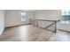 Upstairs loft featuring hardwood floors and natural lighting at 8421 Norman Forest Rd, Lancaster, SC 29720