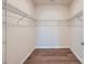 Spacious walk-in closet with ample shelving and wood flooring at 8421 Norman Forest Rd, Lancaster, SC 29720