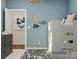 Charming bedroom with a stylish bunk bed, neutral decor, and playful wall decorations at 8426 Norman Forest Rd, Lancaster, SC 29720