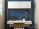 Stylish home office with a modern desk, comfortable chair, and a calming blue accent wall at 8426 Norman Forest Rd, Lancaster, SC 29720