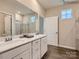 Modern bathroom with dual sinks, a large mirror, and a separate shower, designed for comfort and efficiency at 8436 Norman Forest Rd, Lancaster, SC 29720