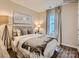 Cozy bedroom featuring a stylish headboard, decorative pillows, and a neutral color palette at 8436 Norman Forest Rd, Lancaster, SC 29720