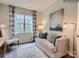 Comfortable living room with a plush sofa, patterned rug, and natural light from a large window at 8436 Norman Forest Rd, Lancaster, SC 29720