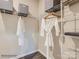 Organized walk-in closet with shelving, hanging rods, and ample storage space, maximizing efficiency and convenience at 8436 Norman Forest Rd, Lancaster, SC 29720