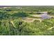 A scenic aerial view of a wooded lot with water access at 000A Duck Cove Rd, Belmont, NC 28012