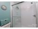 The bright bathroom features a walk-in shower and is nicely decorated with a bright green theme at 1001 N Cannon Blvd, Kannapolis, NC 28083