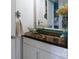 Chic bathroom features a sleek glass bowl sink and stylish wood countertop, accented by modern decor at 1001 N Cannon Blvd, Kannapolis, NC 28083
