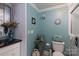 The bathroom features chic teal accents, stylish decor, and a modern toilet for comfort and style at 1001 N Cannon Blvd, Kannapolis, NC 28083