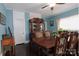 The dining room boasts beautiful hardwood floors, ornate furnishings, and a cozy atmosphere at 1001 N Cannon Blvd, Kannapolis, NC 28083