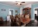 The dining room features a large wooden table, ornate china cabinet, and lovely blue walls at 1001 N Cannon Blvd, Kannapolis, NC 28083