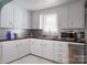 Modern kitchen featuring sleek appliances, ample counter space, and custom cabinetry at 1001 N Cannon Blvd, Kannapolis, NC 28083