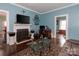 Warm living room with a fireplace, hardwood floors, and ample space for relaxation and entertainment at 1001 N Cannon Blvd, Kannapolis, NC 28083