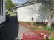 A functional side yard featuring a stone path, tasteful plantings, and exterior of house at 1001 N Cannon Blvd, Kannapolis, NC 28083