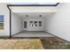 Covered back porch with recessed lighting and three windows offering a relaxing outdoor space at 1037 Dameron Rd, Bessemer City, NC 28016