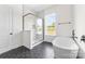 Modern bathroom with soaking tub, glass shower, and hexagon tile floors at 1037 Dameron Rd, Bessemer City, NC 28016