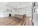 Large kitchen island, white cabinets and countertops, and stainless appliances at 1037 Dameron Rd, Bessemer City, NC 28016