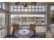 Balcony view with outdoor seating overlooking a serene lake at 107 Pier 33 Dr # 103, Mooresville, NC 28117