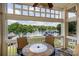 Charming balcony view overlooking the lake with a stone table and chairs, creating a serene outdoor living space at 107 Pier 33 Dr # 103, Mooresville, NC 28117