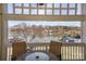 Balcony view with outdoor seating overlooking a serene lake at 107 Pier 33 Dr # 103, Mooresville, NC 28117