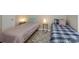Cozy bedroom showcasing two twin beds and bright natural lighting at 107 Pier 33 Dr # 103, Mooresville, NC 28117