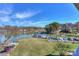 Scenic lakeside with clear skies, a variety of boats, and lush greenery at 107 Pier 33 Dr # 103, Mooresville, NC 28117
