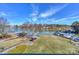 Scenic lakeside with clear skies, a variety of boats, and lush greenery at 107 Pier 33 Dr # 103, Mooresville, NC 28117