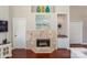 Cozy living room featuring a stone fireplace, wet bar, and access to adjacent rooms at 107 Pier 33 Dr # 103, Mooresville, NC 28117
