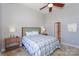 Comfortable main bedroom featuring a ceiling fan and tile floors at 107 Pier 33 Dr # 103, Mooresville, NC 28117
