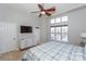Main bedroom featuring a ceiling fan, tile flooring, and waterfront views at 107 Pier 33 Dr # 103, Mooresville, NC 28117