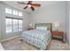 Spacious main bedroom with large windows overlooking a scenic waterfront at 107 Pier 33 Dr # 103, Mooresville, NC 28117