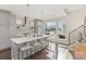Modern kitchen with a spacious island, pendant lighting, stainless steel appliances, and ample natural light at 107 W Poindexter Dr, Charlotte, NC 28203