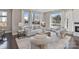 Cozy living room bathed in natural light with a fireplace and hardwood floors at 107 W Poindexter Dr, Charlotte, NC 28203