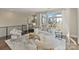 Bright living room featuring modern furnishings, neutral color palette, and large windows with neighborhood views at 107 W Poindexter Dr, Charlotte, NC 28203