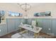 Office space featuring a stylish desk, comfortable seating, and natural light from the windows at 107 W Poindexter Dr, Charlotte, NC 28203
