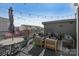 A rooftop deck with patio furniture and string lights, perfect for entertaining at 107 W Poindexter Dr, Charlotte, NC 28203