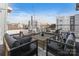Rooftop deck featuring comfortable seating and views of the city skyline at 107 W Poindexter Dr, Charlotte, NC 28203