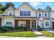Charming townhouse featuring a well-maintained lawn and brick accents at 110 Rhett Ct, Fort Mill, SC 29715
