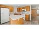 Bright kitchen featuring an island, wooden cabinets, and modern appliances at 110 Rhett Ct, Fort Mill, SC 29715